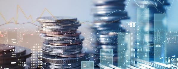 Cityscape and coins stacked up